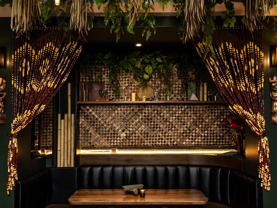 The Lobby Tiki Bar Oceanside CA — beaded curtains, tiki carvings, booth seating