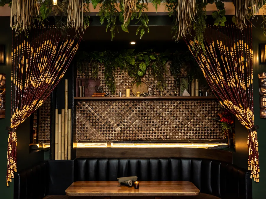 The Lobby Tiki Bar Oceanside CA — beaded curtains, tiki carvings, booth seating
