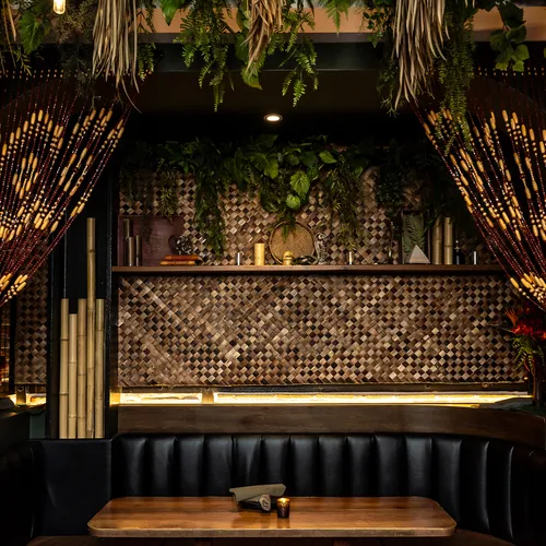 The Lobby Tiki Bar Oceanside — beaded curtains and warm tiki lighting