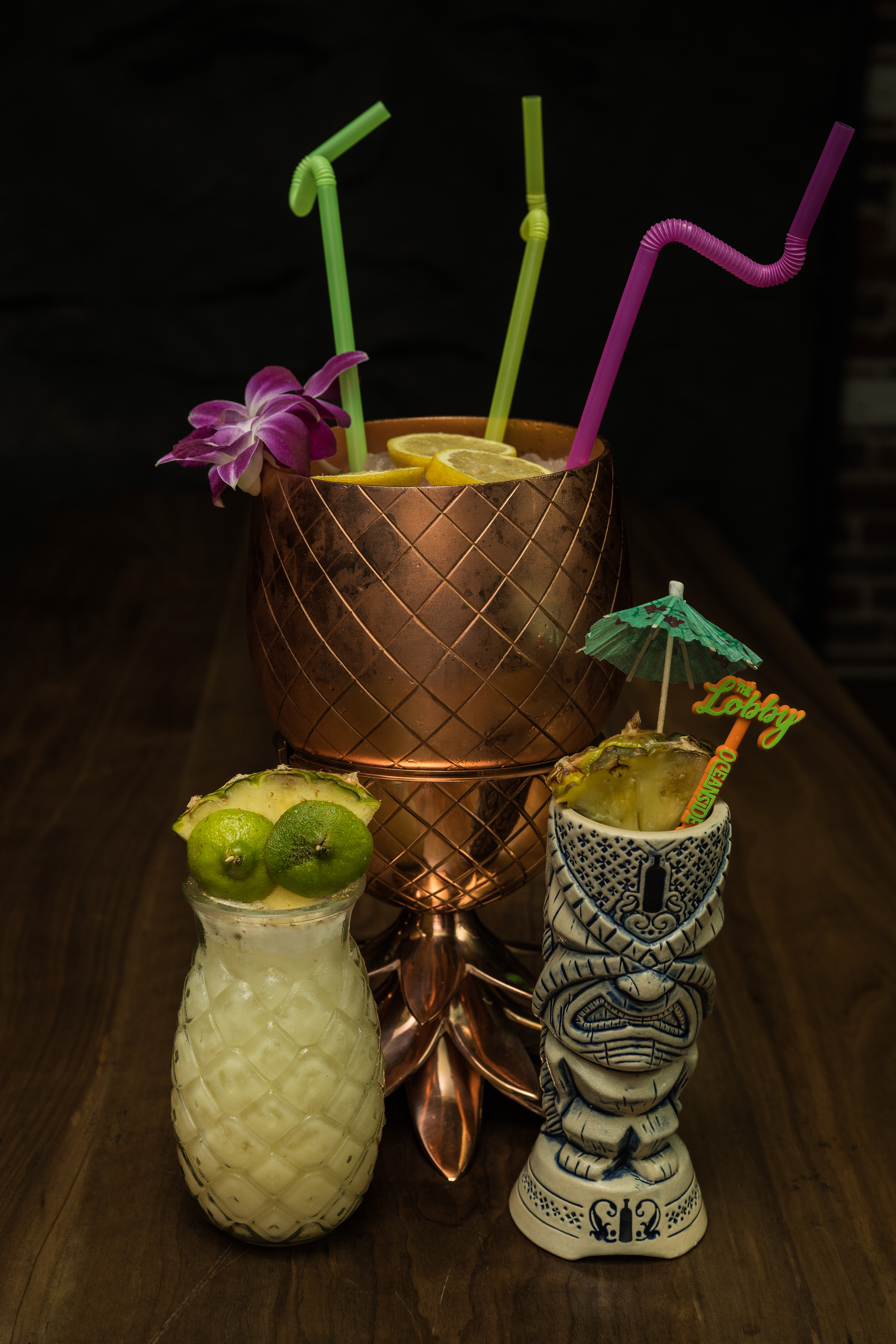 Three colorful tiki cocktails served at The Lobby Tiki Bar in Oceanside